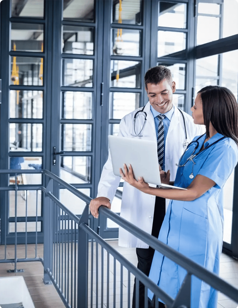 Medical team looking at laptop in the hospital